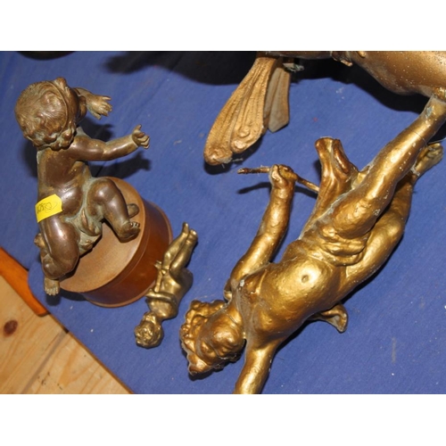 129 - After Augustus Moreau: a bronze figure of a putto and three other metal putti