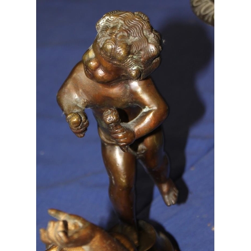 129 - After Augustus Moreau: a bronze figure of a putto and three other metal putti