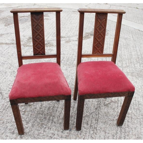 646 - A pair of carved oak standard chairs with Gothic splat backs, blind fret and drop-in seats, on carve... 