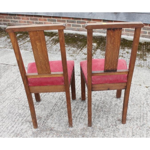 646 - A pair of carved oak standard chairs with Gothic splat backs, blind fret and drop-in seats, on carve... 