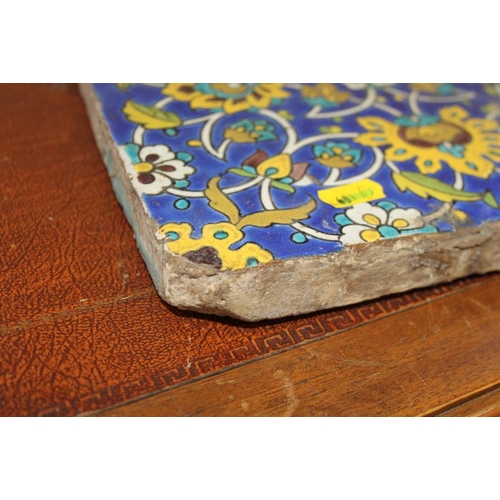 211 - A Persian 19th century floral patterned tile, 10