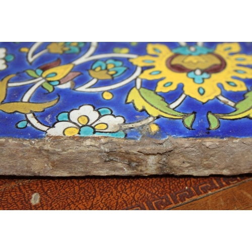 211 - A Persian 19th century floral patterned tile, 10