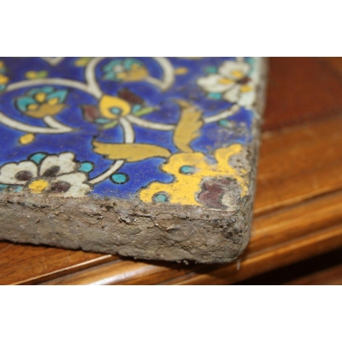 211 - A Persian 19th century floral patterned tile, 10