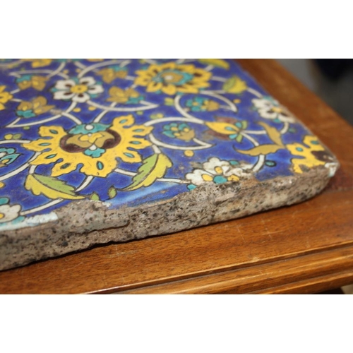 211 - A Persian 19th century floral patterned tile, 10