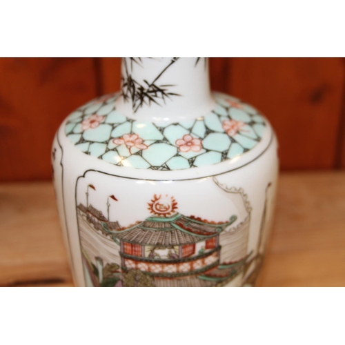 54 - A Chinese famille vert vase, decorated pagoda and verse, 8 1/4