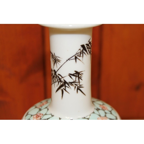 54 - A Chinese famille vert vase, decorated pagoda and verse, 8 1/4