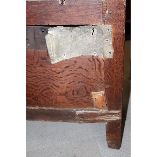 507 - An early 18th century chip carved coffer with triple panel lid, on moulded stile supports (retaining... 