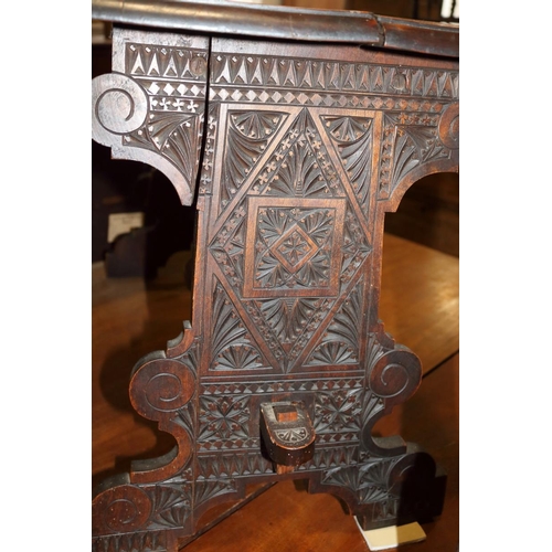 507 - An early 18th century chip carved coffer with triple panel lid, on moulded stile supports (retaining... 