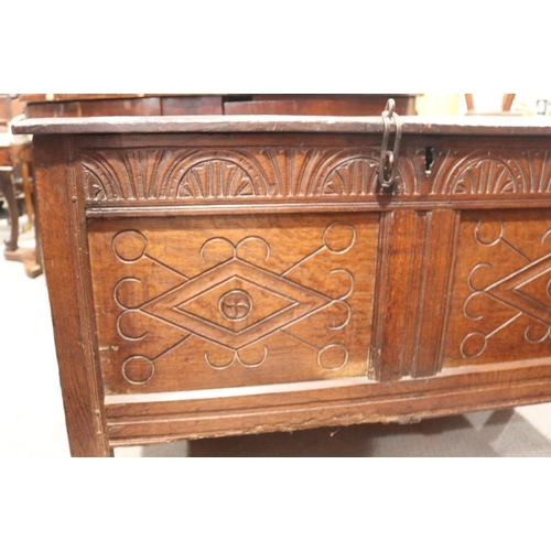 507 - An early 18th century chip carved coffer with triple panel lid, on moulded stile supports (retaining... 