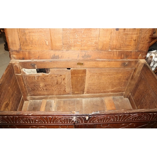 507 - An early 18th century chip carved coffer with triple panel lid, on moulded stile supports (retaining... 