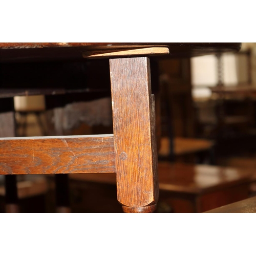 509 - An 18th century oak provincial drop leaf occasional table, on turned and stretchered gate leg suppor... 