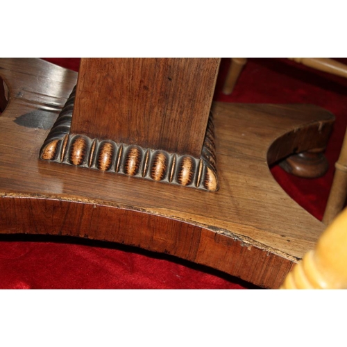 511 - A mid Victorian rosewood circular tilt top loo table, on square column and quadraform base, 48