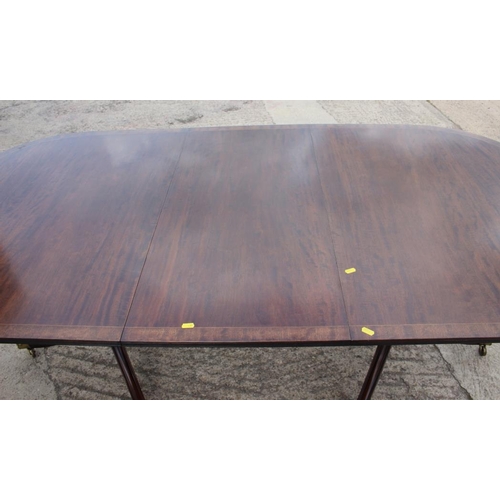 639 - A mahogany and banded double pedestal dining table of Georgian design, 39