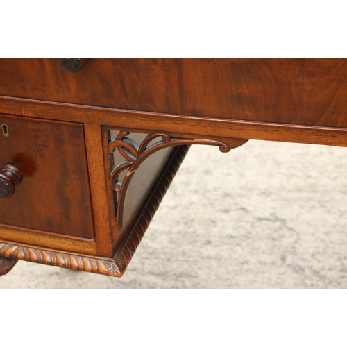 640 - A walnut bowfront desk, fitted one long and two deep drawers, on carved cabriole claw and ball suppo... 