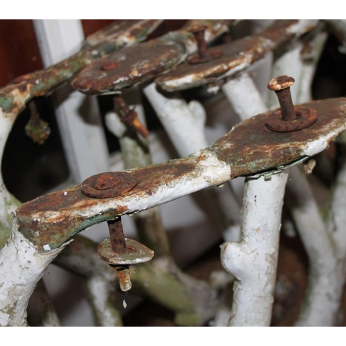 700 - A pair of cast iron bench ends of naturalistic form