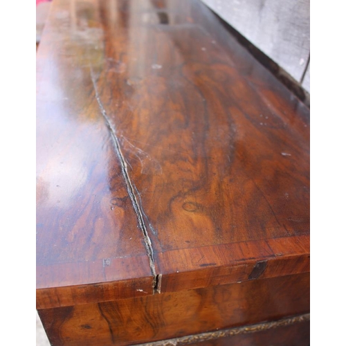 535 - A late Victorian walnut and banded credenza/pier cabinet enclosed two arch top mirror panelled doors... 