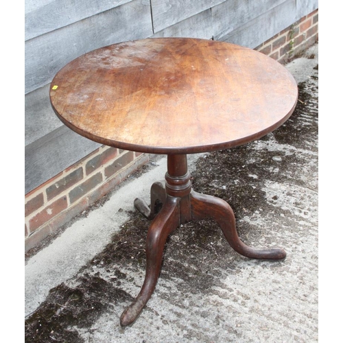 551 - A Georgian mahogany circular tilt top table, on canon barrel turned column and tripod splay support ... 