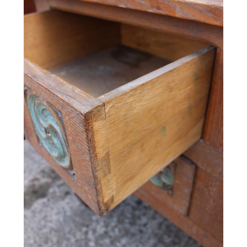 553 - A mid 19th century Gothic carved oak dressing chest, fitted four drawers with wrought handles, on st... 