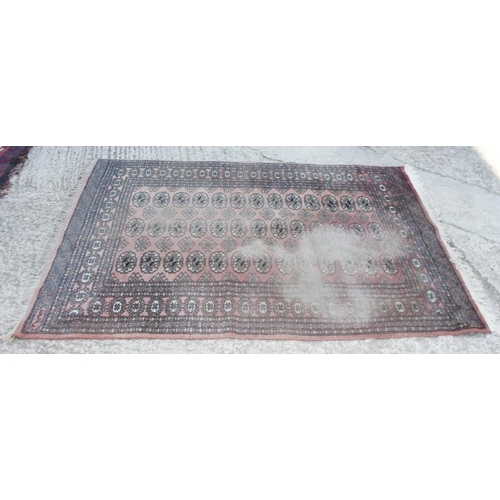 698 - A tapestry rug with elephant design in shades of red and fawn, 68