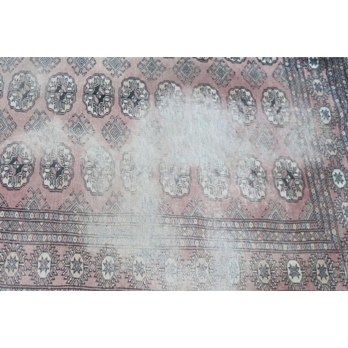 698 - A tapestry rug with elephant design in shades of red and fawn, 68