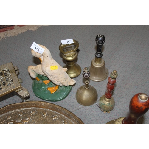 116 - Four brass bells, a door stop, in the form of a duck, a paperclip, two weights and a Middle Eastern ... 