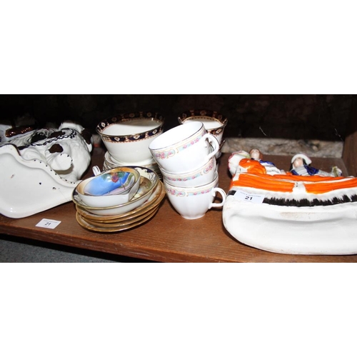 21 - Three pairs of Staffordshire dogs, a Taunton wash jug, bowl and basin, platters teacups, saucers and... 