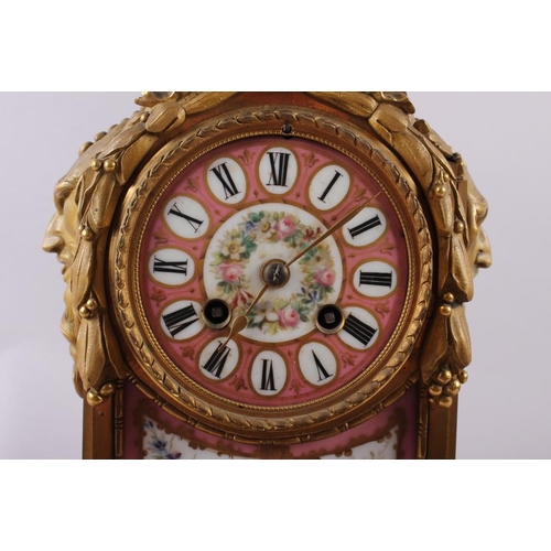 95 - An English gilt metal cased mantel clock with pink, gilt and floral spray dial and panels, and Roman... 