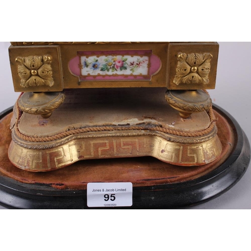 95 - An English gilt metal cased mantel clock with pink, gilt and floral spray dial and panels, and Roman... 