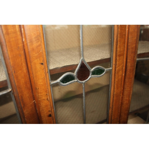 494 - A late 19th century walnut double bowfront display cabinet enclosed leaded glazed doors, on cabriole... 