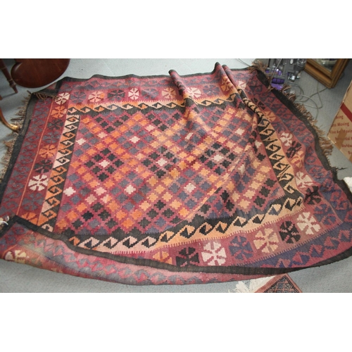 697 - A kelim rug with all-over geometric design to the centre ground, in shades of plum black and natural... 