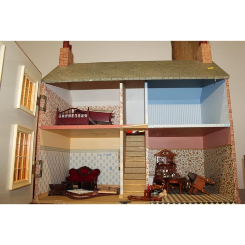 188 - A child's 1950s design dolls house, including furniture and Sylvanian Families style toys