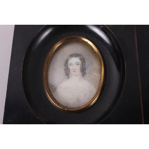 406 - A 19th century portrait miniature of a woman with auburn ringlets, in gilt frame and four other mini... 