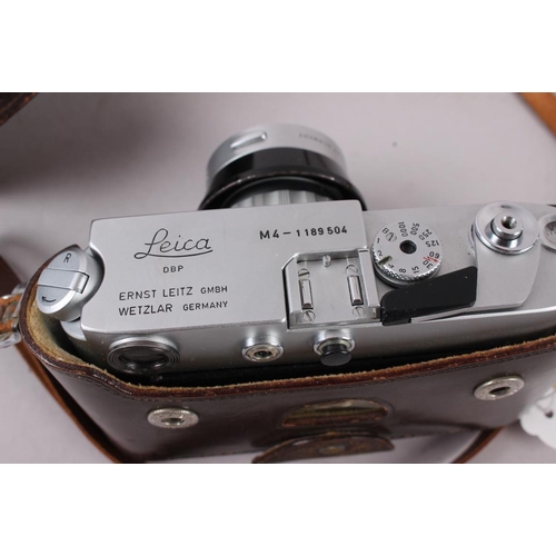 90 - A Leica M4 Rangefinder camera, Chrome No 1189504, circa 1967, with a Summicorn 50mm fs No 1704249 le... 