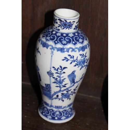 53 - A pair of 19th century Chinese blue and white vases, decorated panels with figures, birds and flora ... 