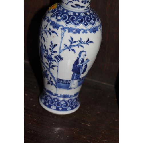 53 - A pair of 19th century Chinese blue and white vases, decorated panels with figures, birds and flora ... 