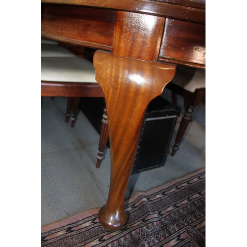 559 - A 19th century mahogany extending dining table with three extra leaves, on cabriole supports and pad... 