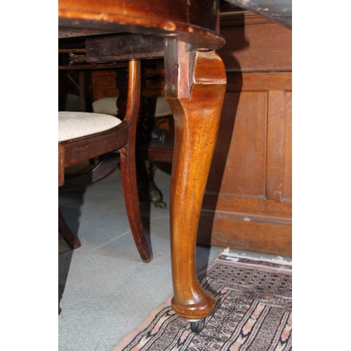 559 - A 19th century mahogany extending dining table with three extra leaves, on cabriole supports and pad... 