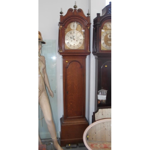 579 - A late Georgian provincial oak longcase clock with eight-day striking movement, silvered dial, gilt ... 