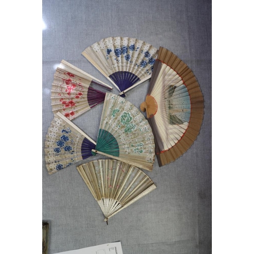 236 - A collection of late 19th century and later Continental fans with pasted decoration (damages)