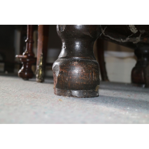 517 - A George III walnut and banded chest of four graduated long drawers with brass drop handles, on turn... 