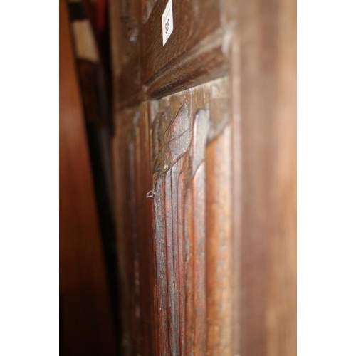 529 - A section of 16th century oak linen-fold panelling, now converted as a bed head, 44