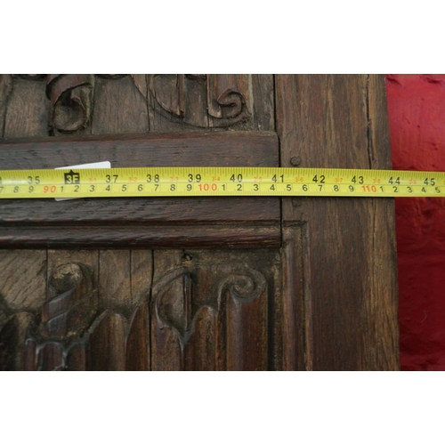 529 - A section of 16th century oak linen-fold panelling, now converted as a bed head, 44