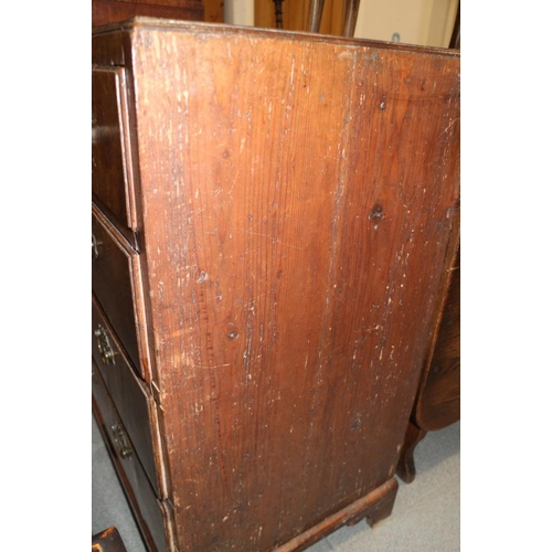 560 - A late Georgian walnut and banded chest of two short and three long drawers with brass handles, on b... 