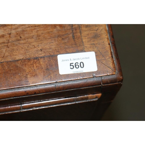 560 - A late Georgian walnut and banded chest of two short and three long drawers with brass handles, on b... 