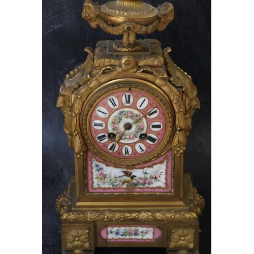 95 - An English gilt metal cased mantel clock with pink, gilt and floral spray dial and panels, and Roman... 