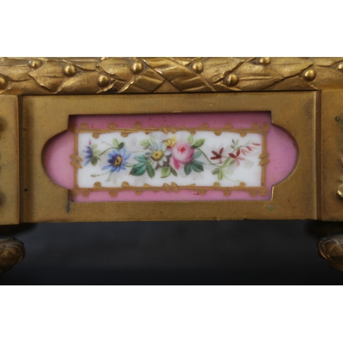 95 - An English gilt metal cased mantel clock with pink, gilt and floral spray dial and panels, and Roman... 