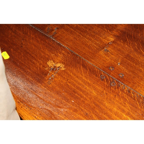 667 - An oak circular low coffee table, on turned and stretchered supports, 48