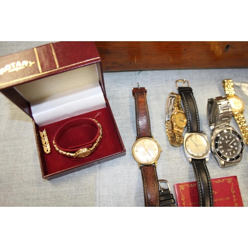 395 - An oak box containing a selection of modern ladies and gentlemen's wristwatches, spares, etc and a s... 