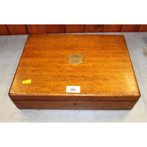 395 - An oak box containing a selection of modern ladies and gentlemen's wristwatches, spares, etc and a s... 