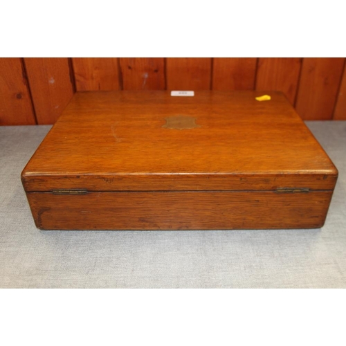 395 - An oak box containing a selection of modern ladies and gentlemen's wristwatches, spares, etc and a s... 